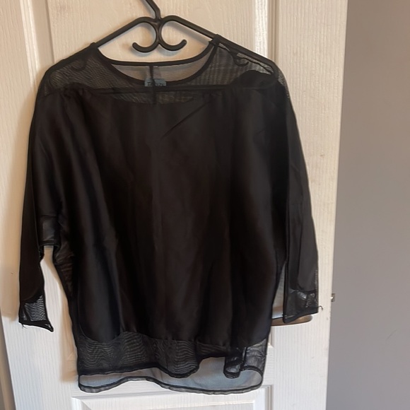A black three quarter long sleeve women’s blouse with silk and sheer design. - Picture 4 of 7
